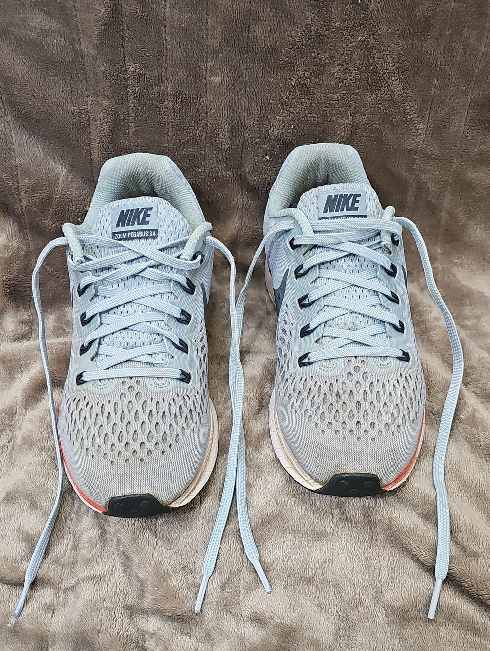 Nike Light Blue Running Shoe with Coral Accent